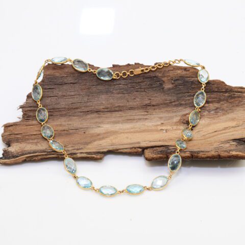 Necklace in 18K Gold with Faceted Blue Topaz Gemstone
